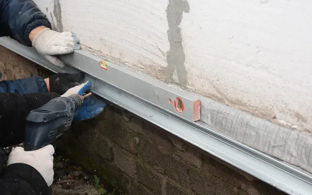 Excavation and shoring under concrete slab foundation for steel pier brackets